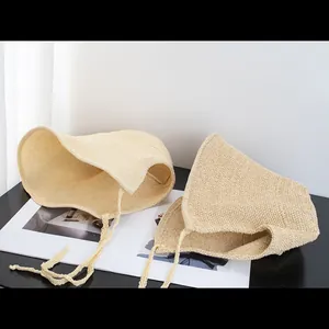 Women's vintage straw sun hat with wide brim and ribbons for summer beach protection