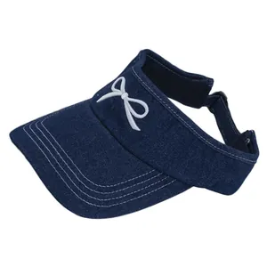 Dark blue denim open top sun hat with white embroidered bow and adjustable strap