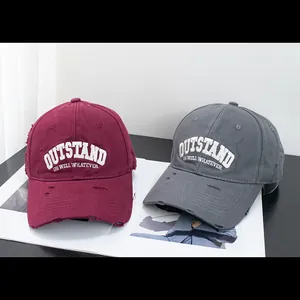 Distressed cotton baseball caps with Outstand embroidery in burgundy and grey