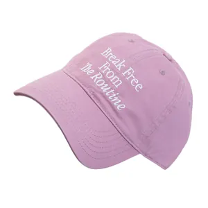 Pink cotton baseball cap with Break Free From The Routine embroidery on white background