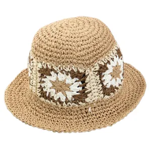 Handcrafted foldable straw sun hat with floral pattern for summer beach travel