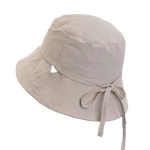 Lightweight breathable beige sun hat for women with ponytail hole and bow tie detail