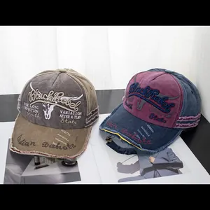 Detail of vintage baseball caps with frayed edges and Black Rebel embroidery