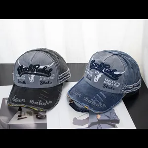 Retro washed denim baseball caps with Black Rebel embroidery and distressed brim details