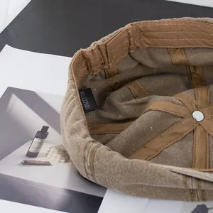Inside detail of a brown cotton painter hat showing high-quality stitching and fabric