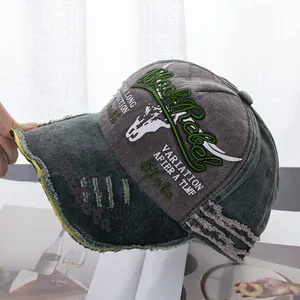 Detail of distressed baseball cap with Black Rebel embroidery and frayed brim texture
