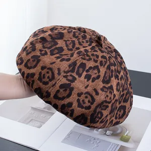Detail shot of vintage leopard print beret made of premium soft suede autumn fabric