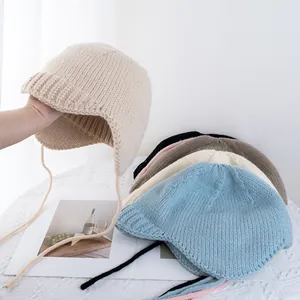 Damen Gestrickte Ohrenklappenmütze Winter Warme Beanie Pilotenmütze Mit Bindebändern Einfarbig Retro Dicke Wollhäkelmütze