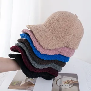Close-up of fluffy faux fur baseball caps in multiple colors for autumn and winter style
