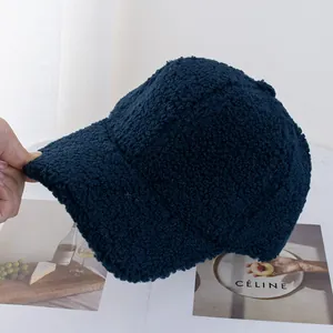 Detail shot of the plush texture on this dark blue faux shearling baseball cap