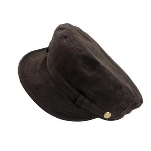 Retro brown suede newsboy cap with gold button detail and flat top in a side view