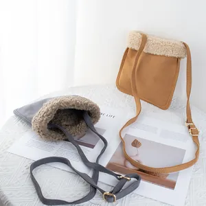 Brown and gray suede crossbody bags with lamb wool trim for autumn and winter style