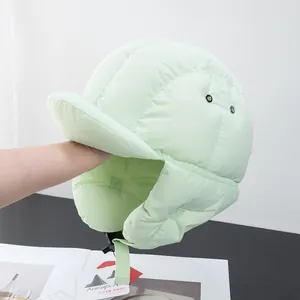 Close-up of light green quilted down trapper hat with windproof fabric and ear flaps