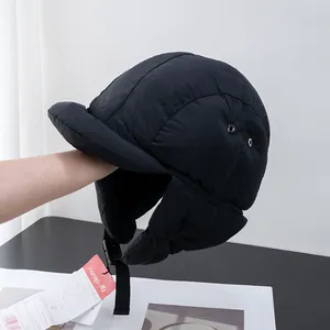 Close-up of quilted waterproof flight hat with metal air vents and buckle strap