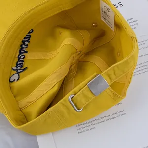 Deep-fit yellow baseball cap with 'Awesome' embroidery under the brim and metal buckle