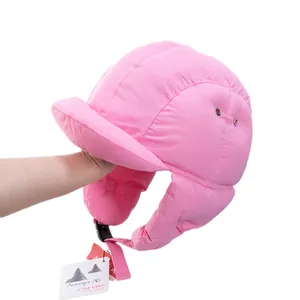 Pink quilted down trapper hat with warm ear flaps and adjustable buckle for winter