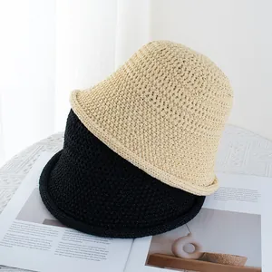 Elegant hollow knit bucket hats in beige and black with rolled edges for women