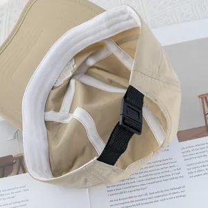 Inside view of quick-dry khaki baseball cap showing mesh sweatband and adjustable buckle