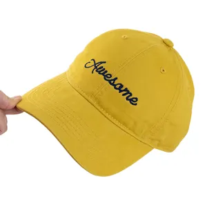 Bright yellow American style baseball cap with Awesome embroidery on a white background