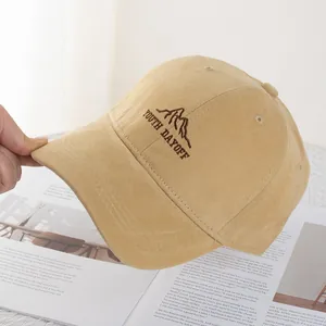 Detailed embroidery of Youth Dayoff lettering on a beige cotton canvas baseball cap