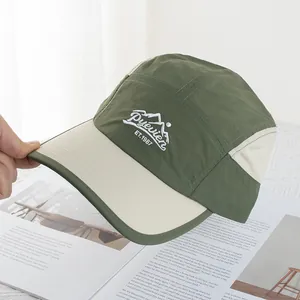Close-up of olive green outdoor cap with mountain embroidery on quick-dry fabric