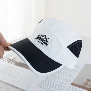 Detail of mountain embroidery and Puevlen text on quick-dry color-block baseball cap