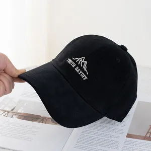 Detailed close-up of youth dayoff embroidery on black cotton baseball cap for women