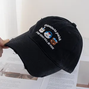 Close-up of cute animal embroidery on black washed baseball cap with distressed details