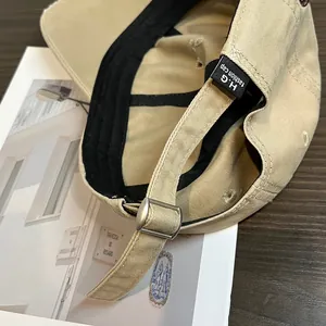 Vintage washed khaki baseball cap with adjustable metal buckle and inner sweatband