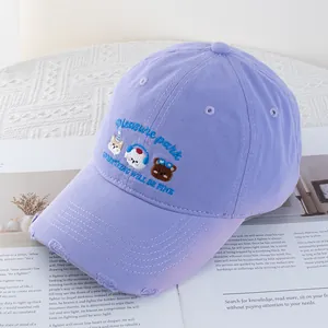 Detail of light purple cotton baseball cap with cartoon animal embroidery and distressed brim