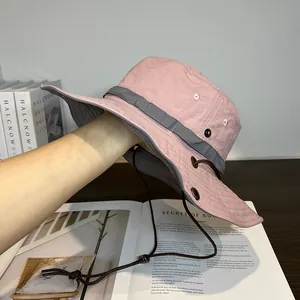 Detailed view of pink quick-dry sun hat featuring a wide brim and adjustable wind rope