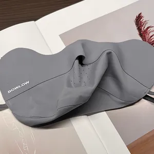 Detail of dark grey breathable sun mask with laser-cut holes and seamless edges