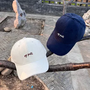 Classic baseball caps in beige and navy cotton featuring front 'my putt' embroidery detail