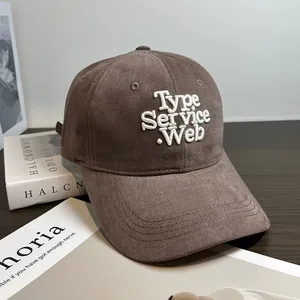Detail of soft brown corduroy baseball cap with 3D white embroidered Type Service text