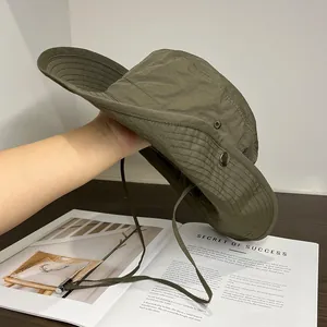 Detail of army green outdoor sun hat with adjustable strap and side ventilation eyelets
