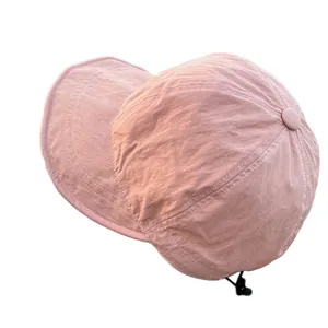 Lightweight quick-dry nylon sun hat in lotus pink with adjustable drawstring closure