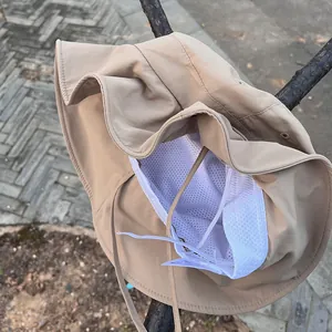 Detail of khaki sun hat featuring breathable mesh lining and adjustable chin strap
