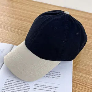 Detailed shot of corduroy baseball cap with contrast brim on a vintage magazine