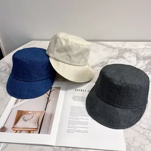 Japanese retro minimalist linen textured fisherman hats in blue, beige, and grey colors