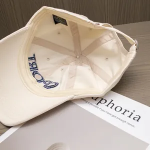 Macro view of inner baseball cap structure with reinforced stitching and logo label