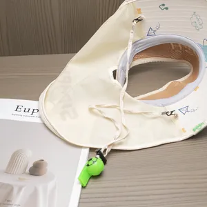 Detail of kids sun hat with breathable mesh, windproof cord and green football whistle