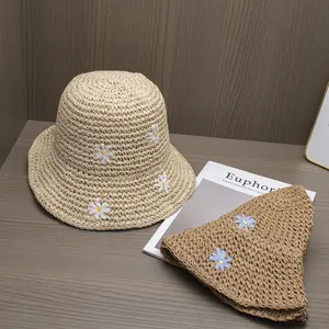 Handmade straw sun hats with daisy embroidery in khaki and brown for summer beach vacation