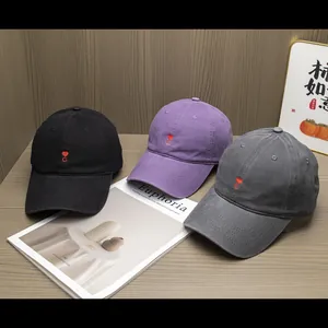 Three cotton baseball caps with heart C embroidery in black, purple and dark grey