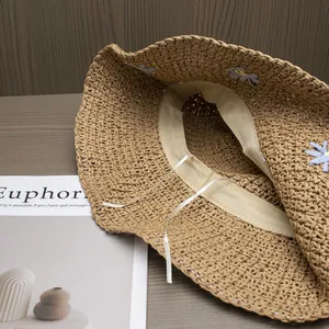 Handmade straw sun hat with daisy embroidery and adjustable inner band for women beach vacation