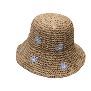 Handmade straw sun hat with embroidered daisies for summer beach vacations and sun protection