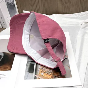 Pink cotton baseball cap with adjustable metal buckle and interior embroidery details