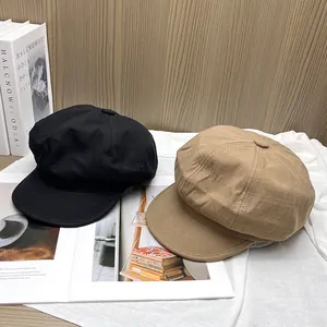 Classic black and khaki newsboy hats with subtle checkered texture for women
