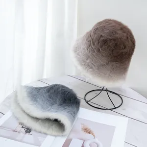Gradient fluffy faux rabbit fur bucket hats in brown and blue-grey for winter warmth