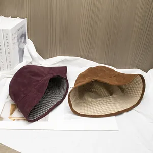 Retro corduroy bucket hats in burgundy and brown with stylish plaid lining detail