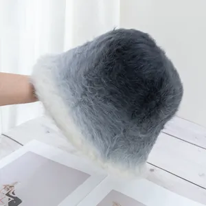 Close-up of soft gradient faux rabbit fur bucket hat with grey to white plush texture